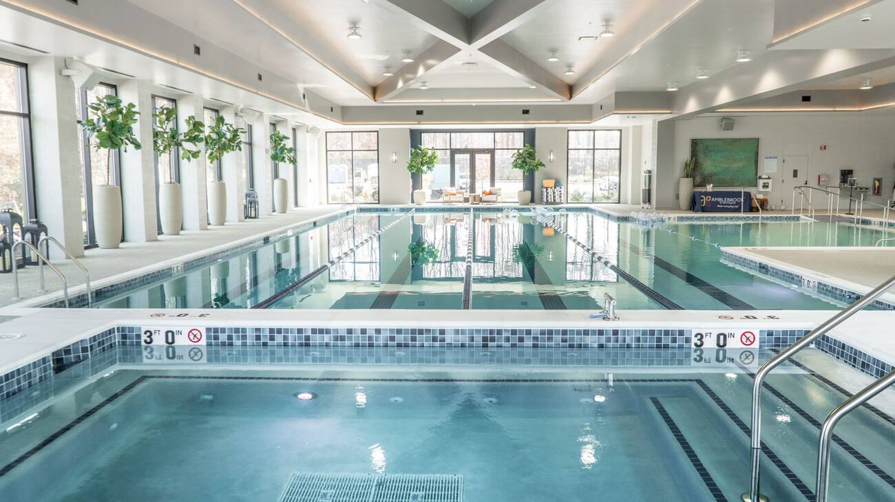 An indoor pool with designated swimming lanes.